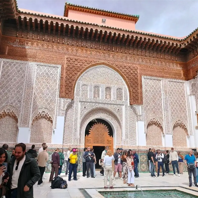 Carved stucco and cedar wood: the details a guide helps you notice